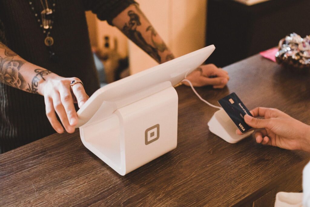 a credit card transaction taking place with a point of sale machine